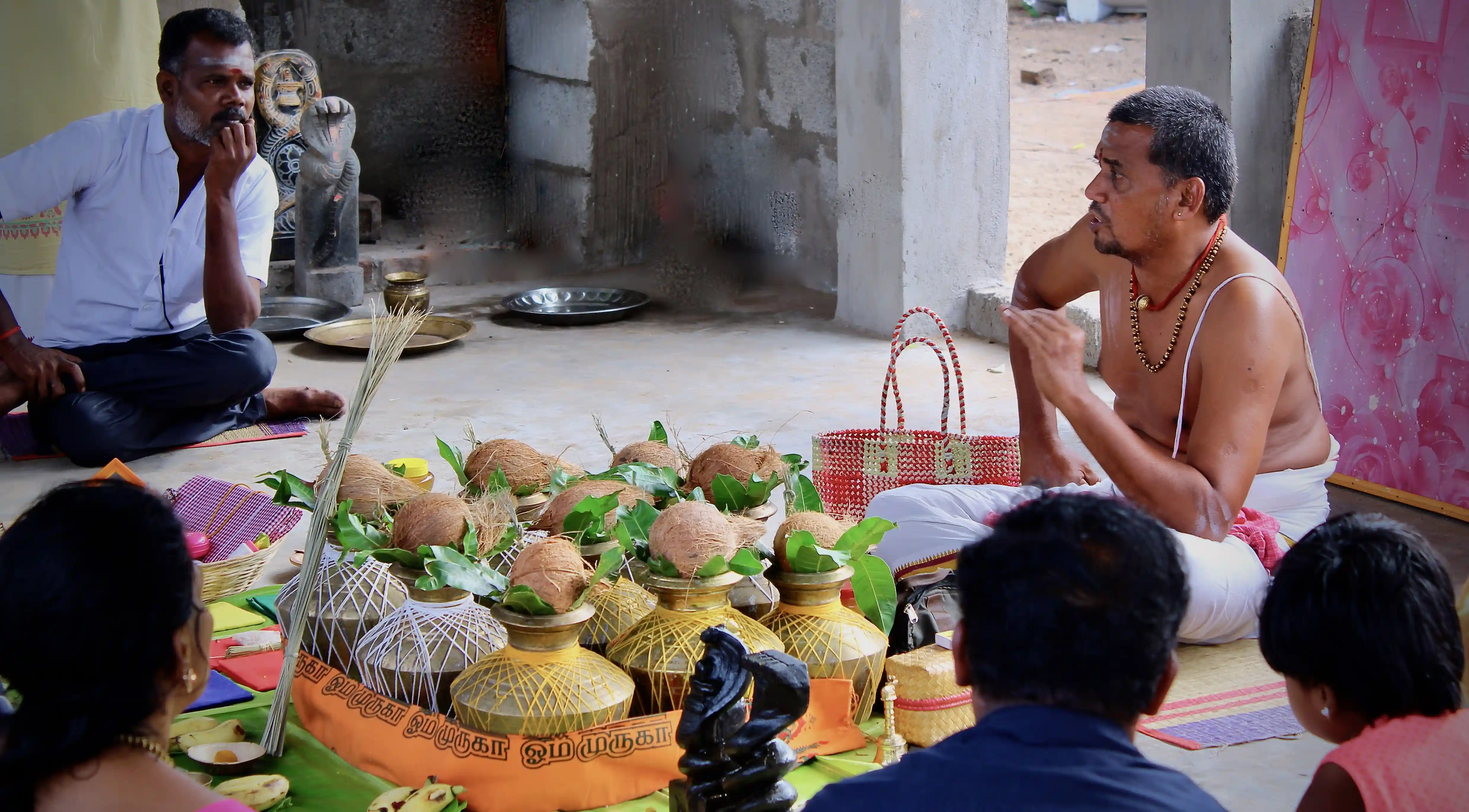 Sambath Sasthri guiding a family through a Pitru Dosha ritual